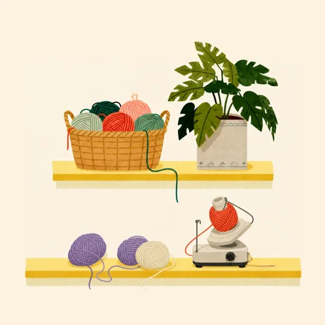 Cozy shelves with yarn, a yarn basket, a plant, and a yarn winder